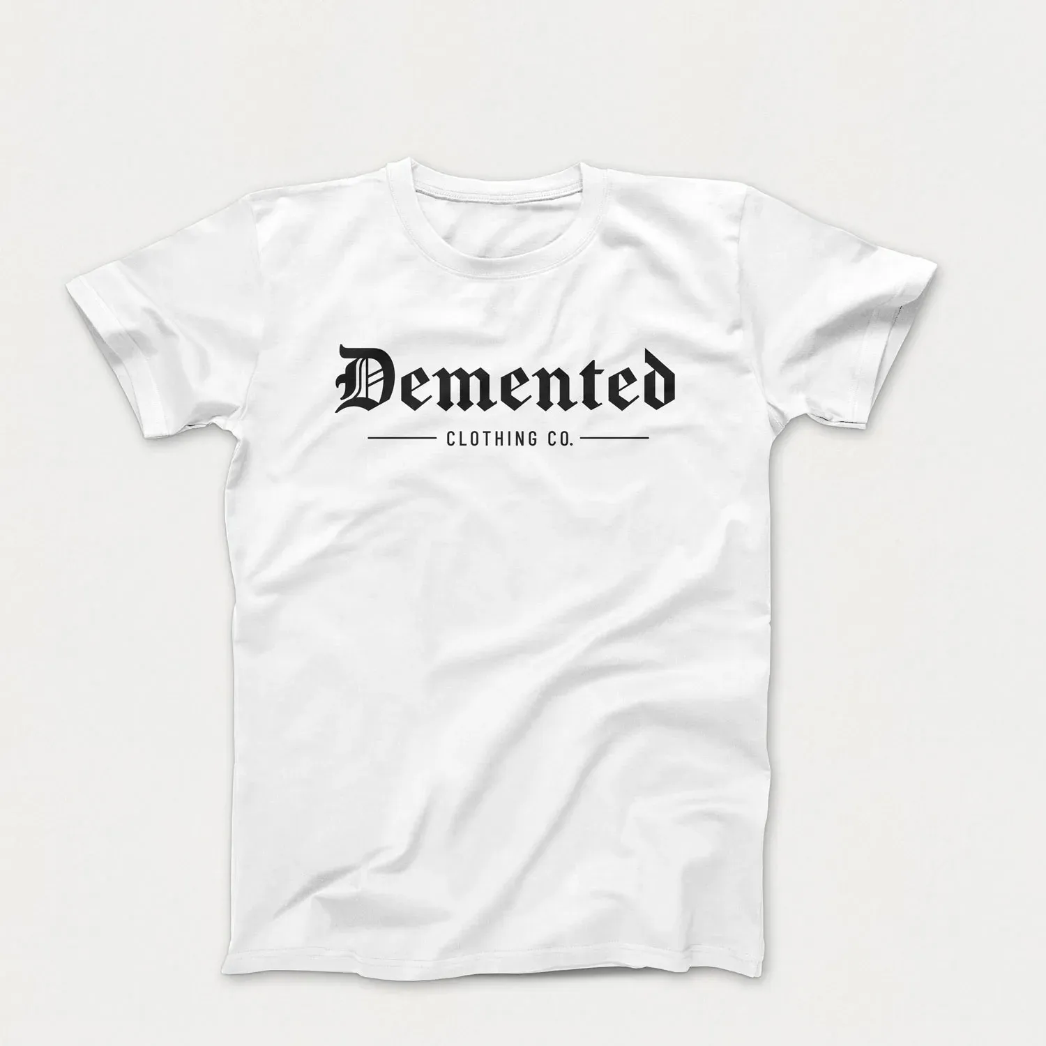 A white Demented t-shirt with the primary logo