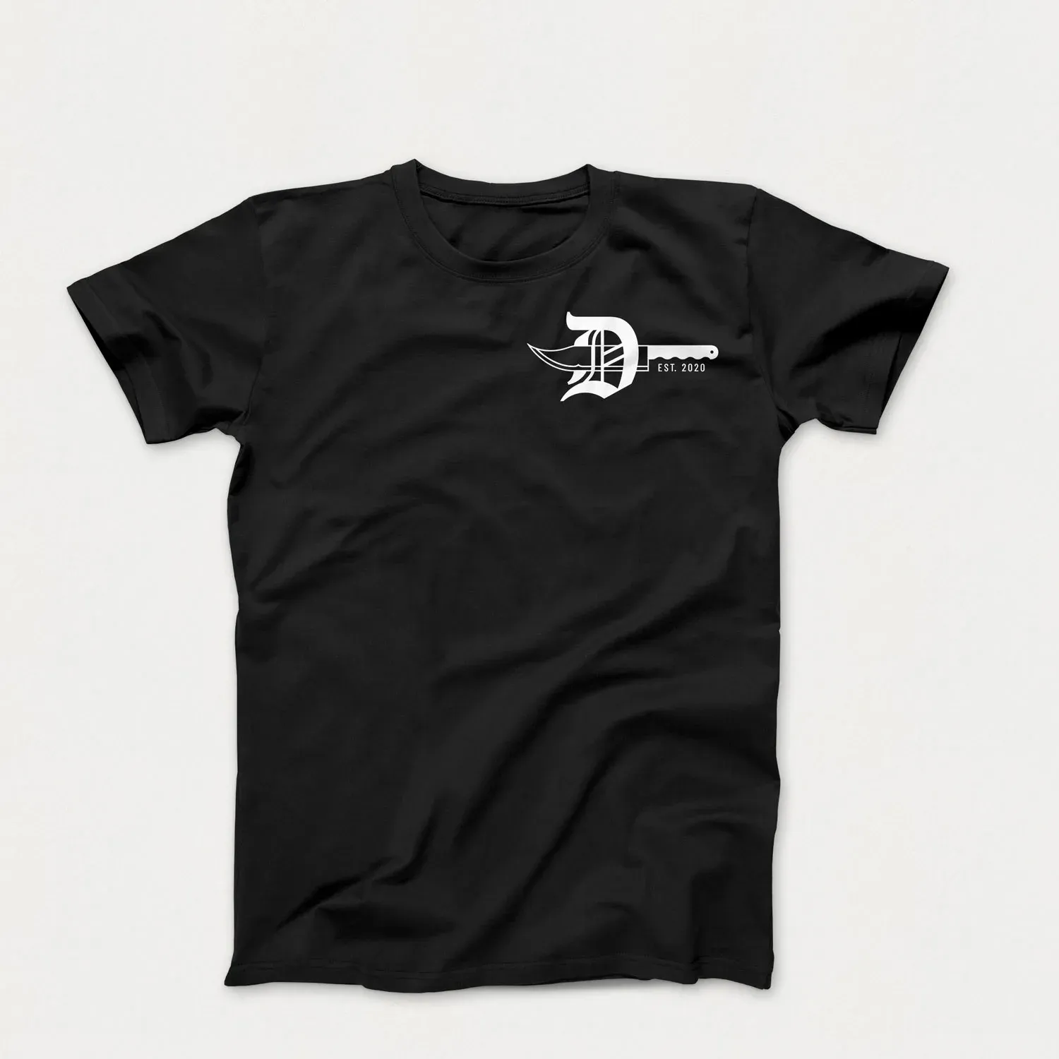 A black Demented t-shirt with the knife badge